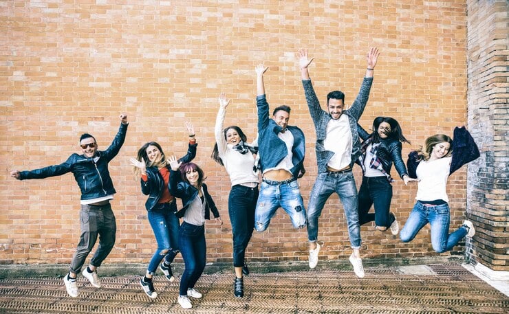 happy-friends-millennials-jumping-cheering